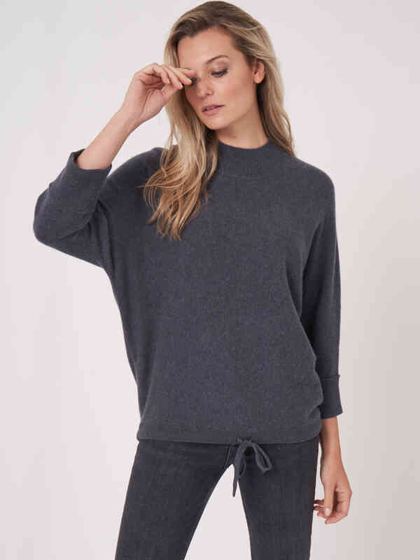 Oversized cashmere sweater with stand collar and tie at waist