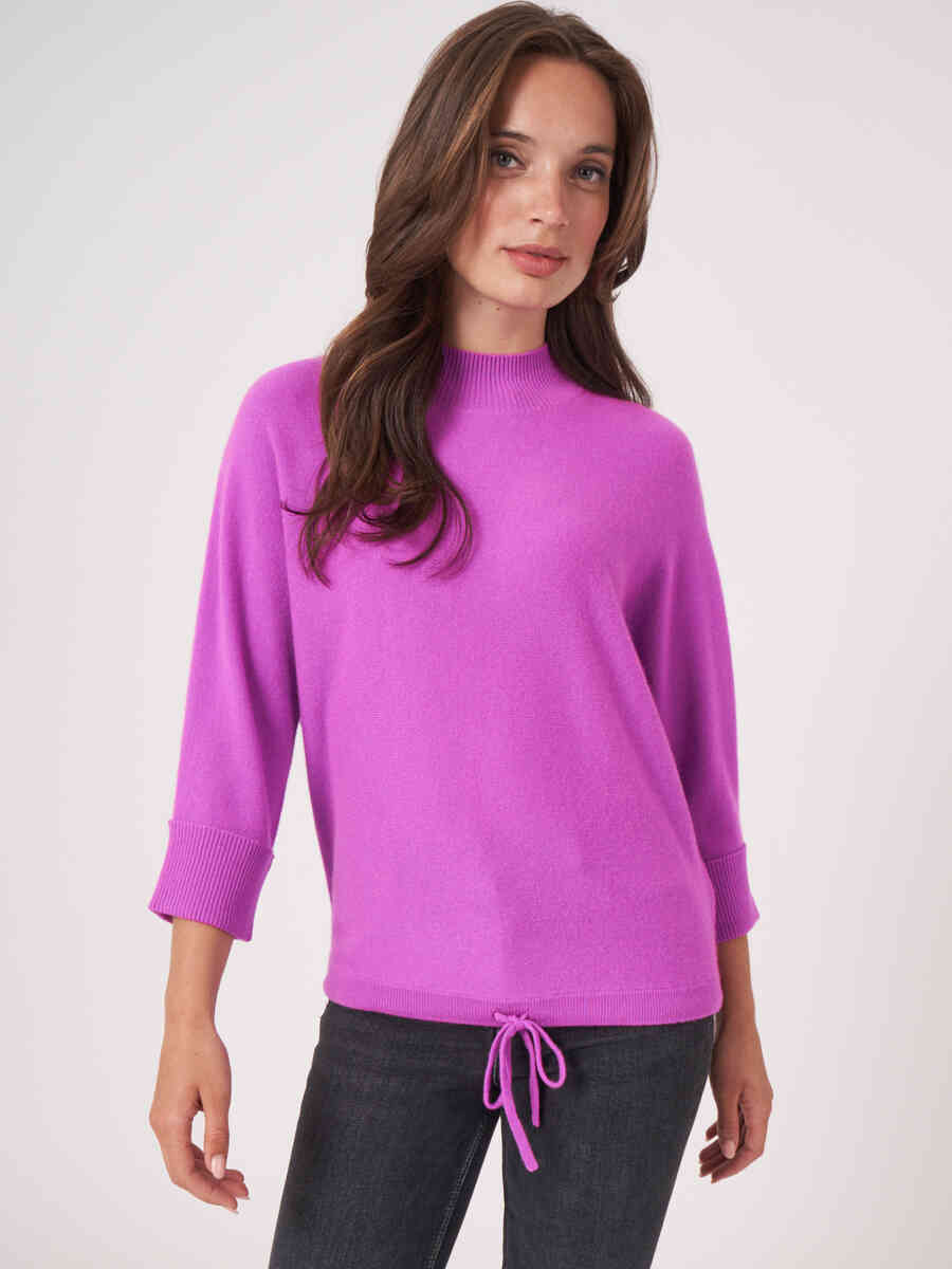 Oversized cashmere sweater with stand collar and tie at waist