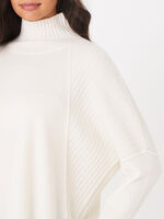 Oversized poncho sweater with ribbed texture and button placket at the back image number 2