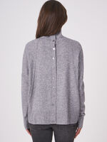 Oversized poncho sweater with ribbed texture and button placket at the back image number 1