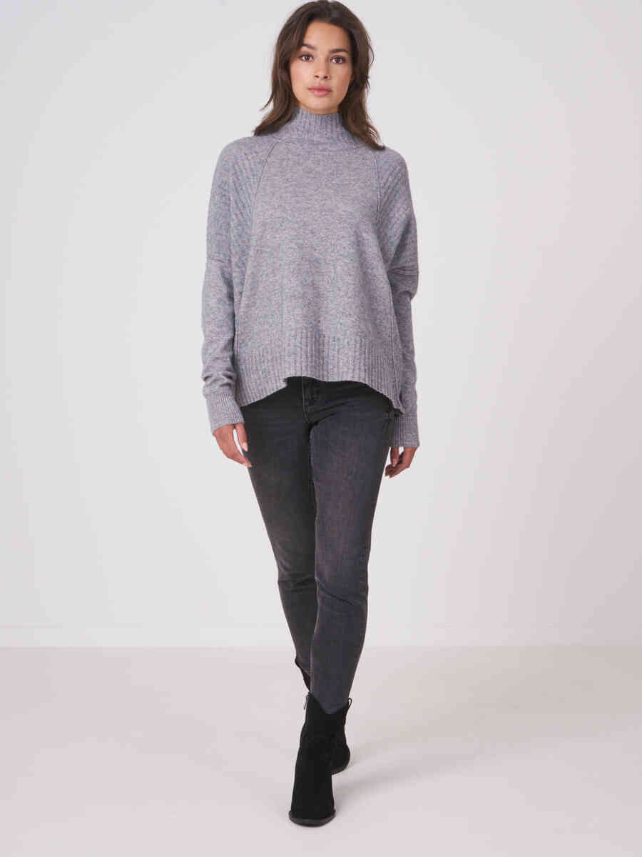 Oversized poncho sweater with ribbed texture and button placket at the back image number 3