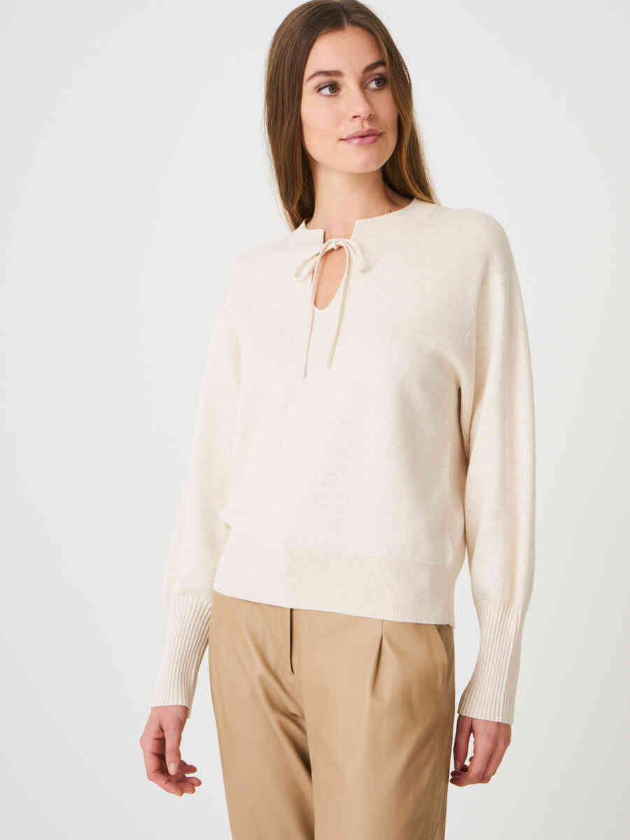 Organic cotton blend pullover with neck string tie and puff sleeves