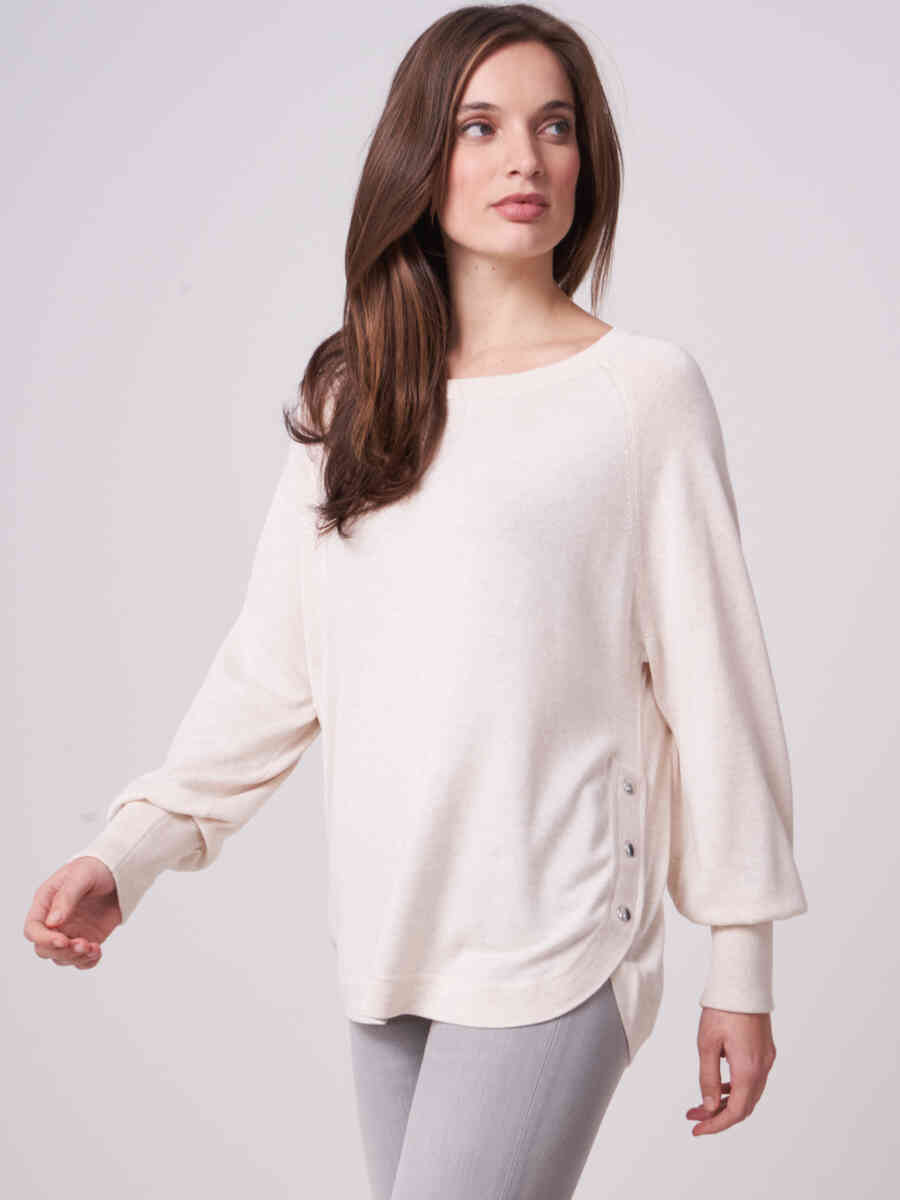 Cotton blend sweater with side buttons and round hem